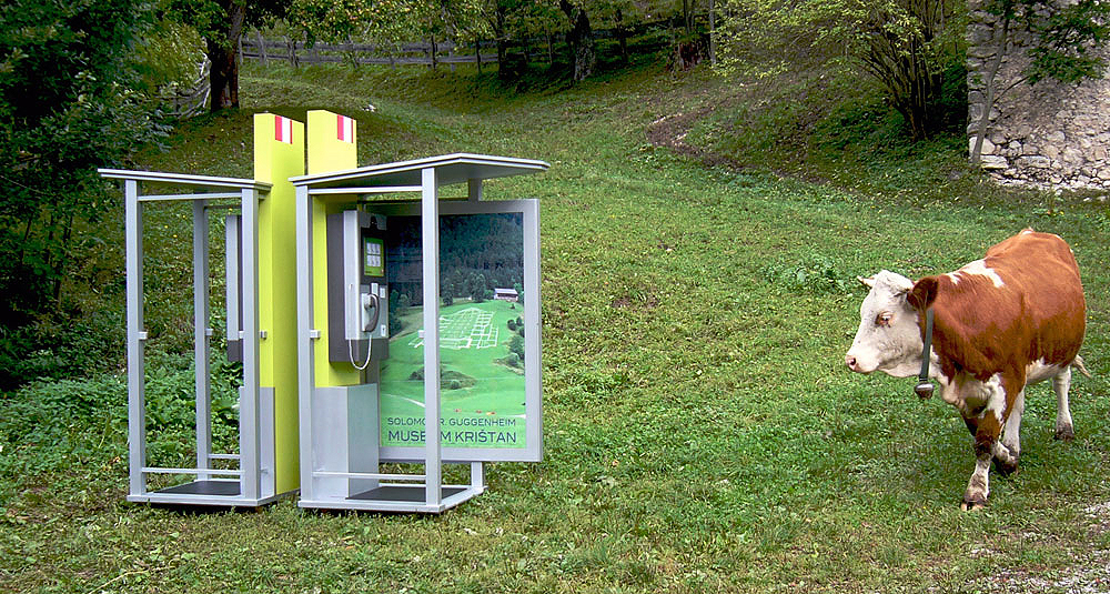 Art, artwork. A project entitled "Guggenheim Krištan" by Kruno Stipesevic and Nika Span / Nika Špan. Two telephone boxes with advertising panels. Material: Wood, paint, two prints, an internet page. Project: Trilateral project Klopfzeichnen/Colp/Potrkavanje 2009/10; Krištan Farm, Zell-Freibach/Sele-Borovnica, Austria