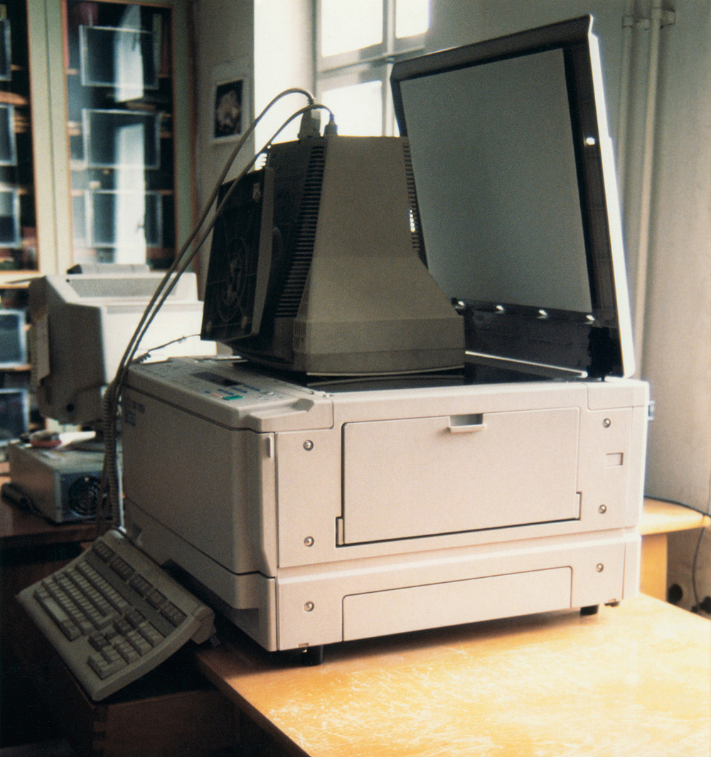 A performance entitled "Reproduction of Information" by Nika Span / Nika Špan. Material: A photocopier, a computer terminal, 72 sheets of paper. Library of the Academy of Fine Arts and Design, Ljubljana, Slovenia